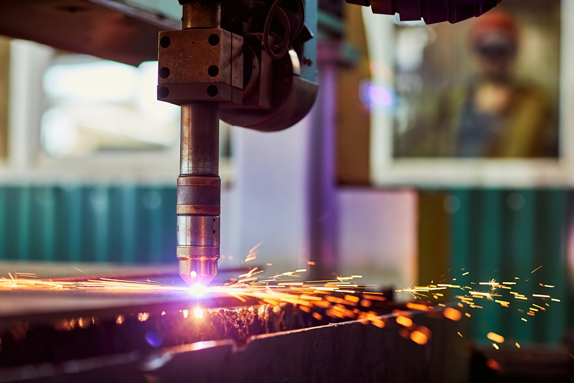 CNC laser plasma. Selective focus on modern technology laser plasma cutting of metal in process
