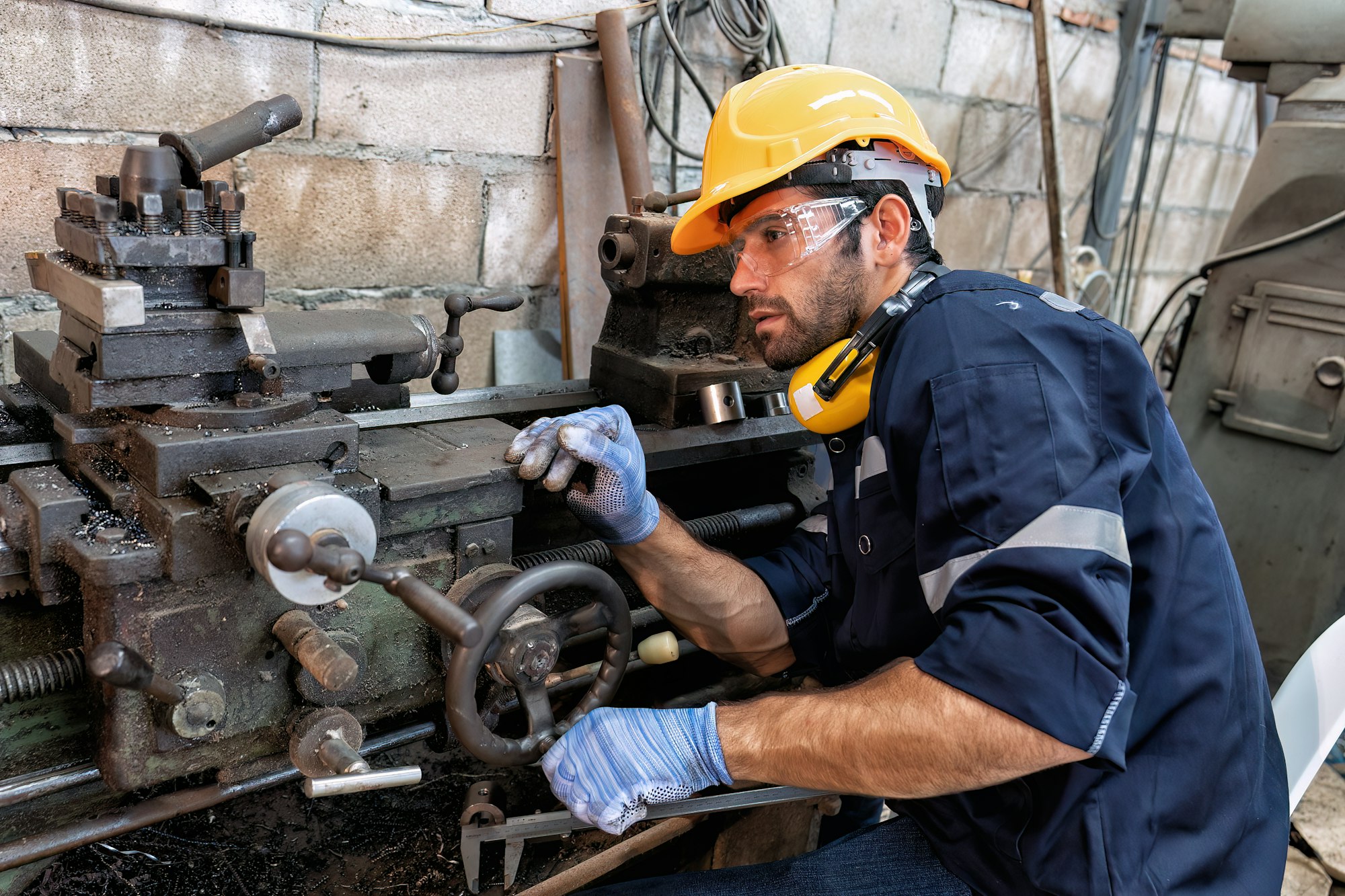 In robotic maintenance repair engineer lathe machine fabricate part and vernier caliper measuring