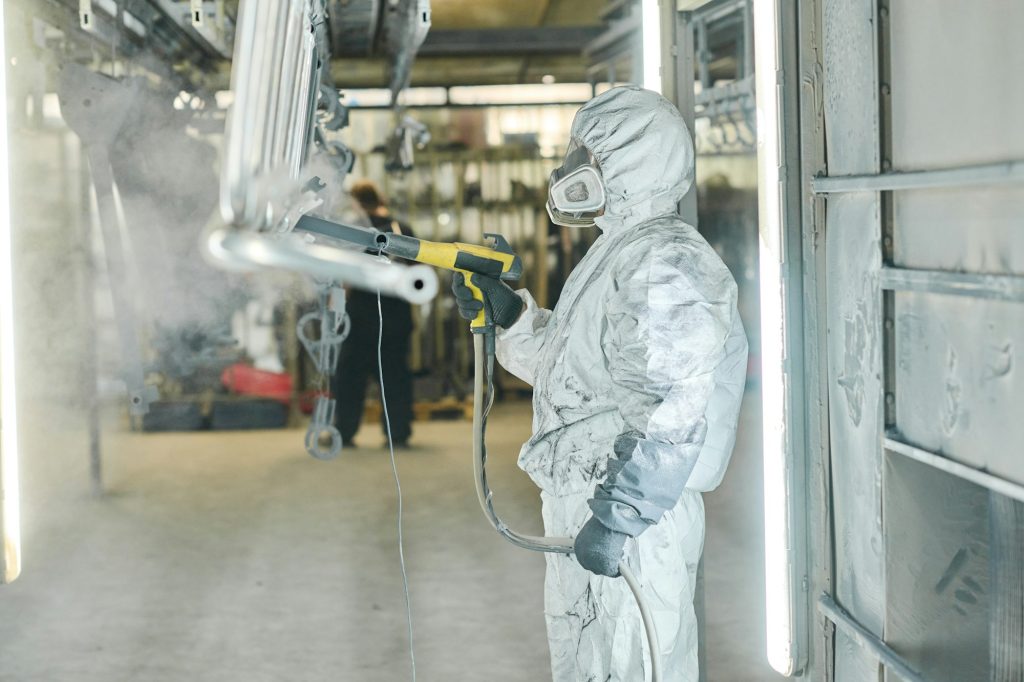 Powder coating of metal products in spray booth